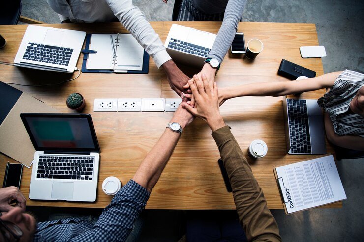 High Pure team collaborating around a workspace